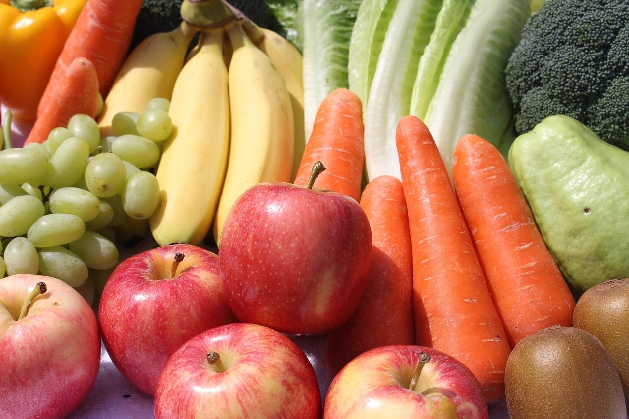 Close-up of carrots, apples, bananas, grapes, lettuce and broccoli